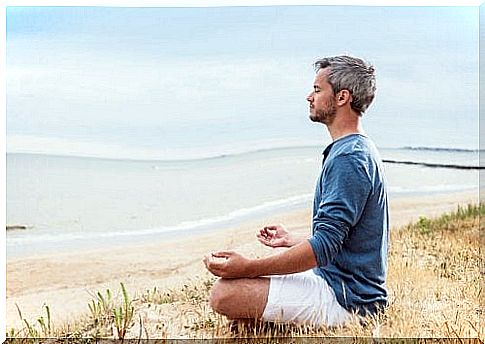 Man meditates on the beach and has ideas