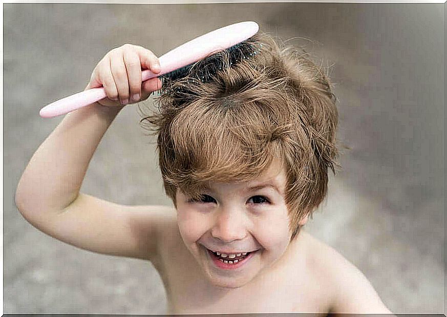 Childhood alopecia - child brushes their hair