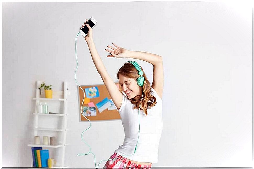 Woman listens to music and dances