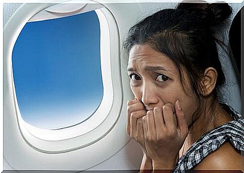 Woman having a panic attack on a plane